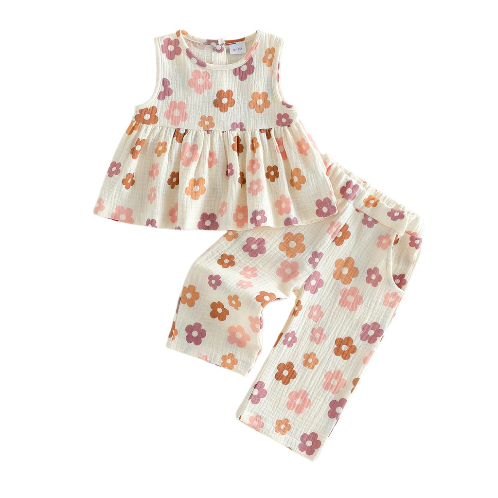 Flowy Sleeveless Top With A Full Floral Print Paired With Pocketed Pants